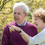 client and caring admiring the garden