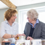 carer discussing the rewarding work of live in care